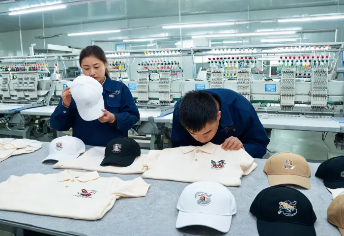 Finished embroidered garments being inspected