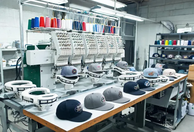 Headwear embroidery setup